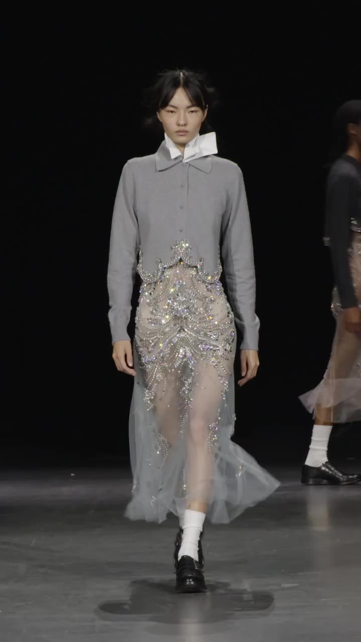 Spring Summer 2027, Look 7; knitted polo shirt in grey mélange with…