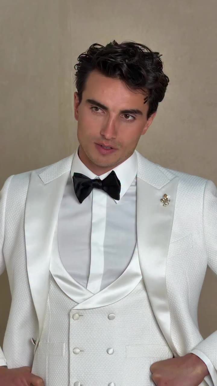 Ivory, done with intention. The Valentino tuxedo pairs a clean ivory finish…