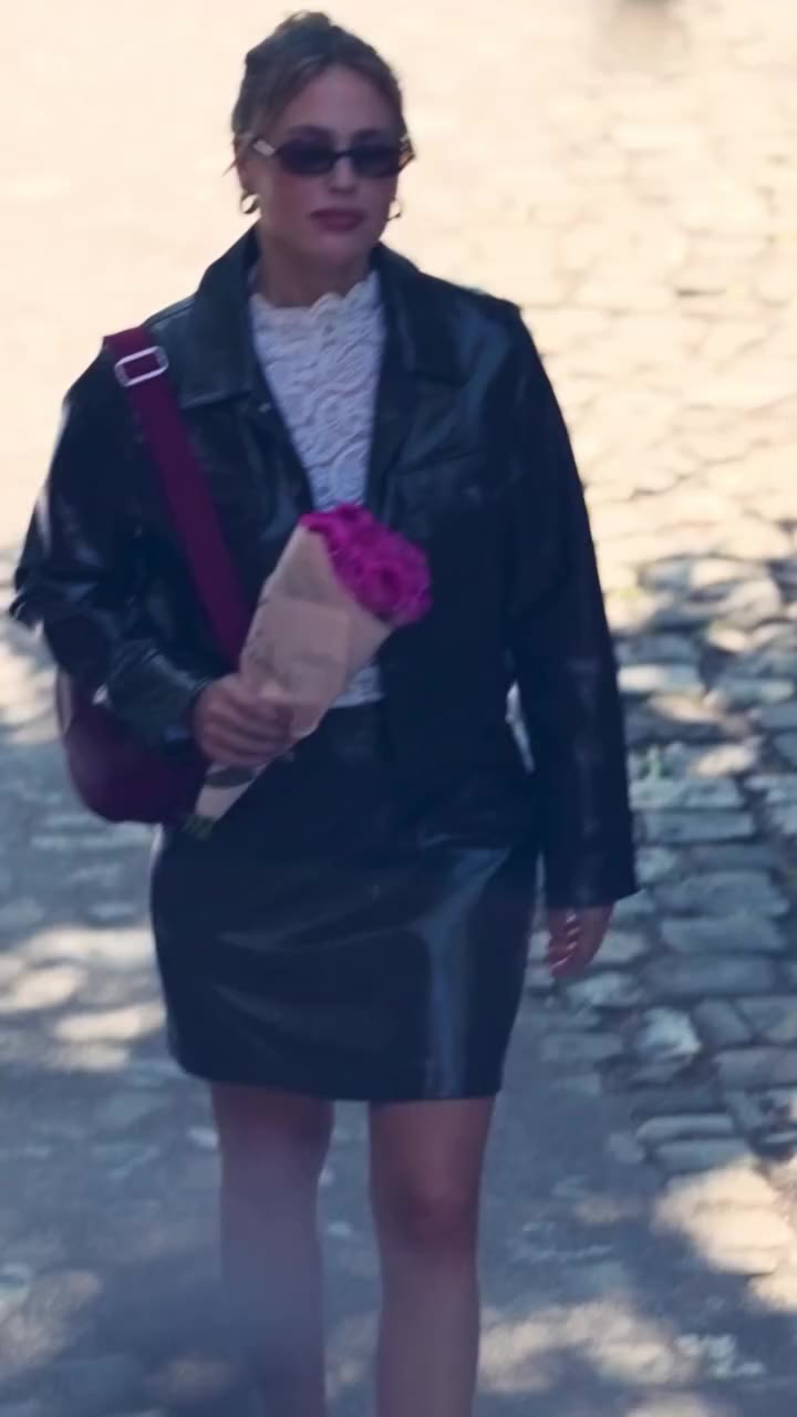 Caught in the moment 💐Bringing a touch of romance to high-shine street style.