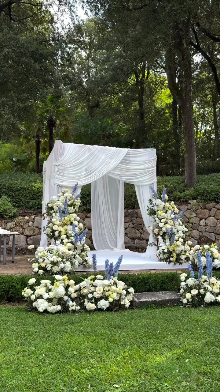 A dreamy ceremony beneath a beautifully draped chuppah, enriched with delicate…