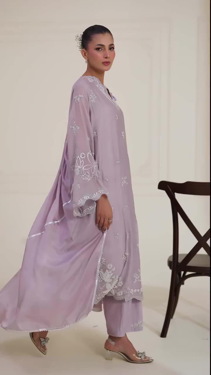 An alluring lilac ensemble, curated on soft pure handloom cotton net, with the…