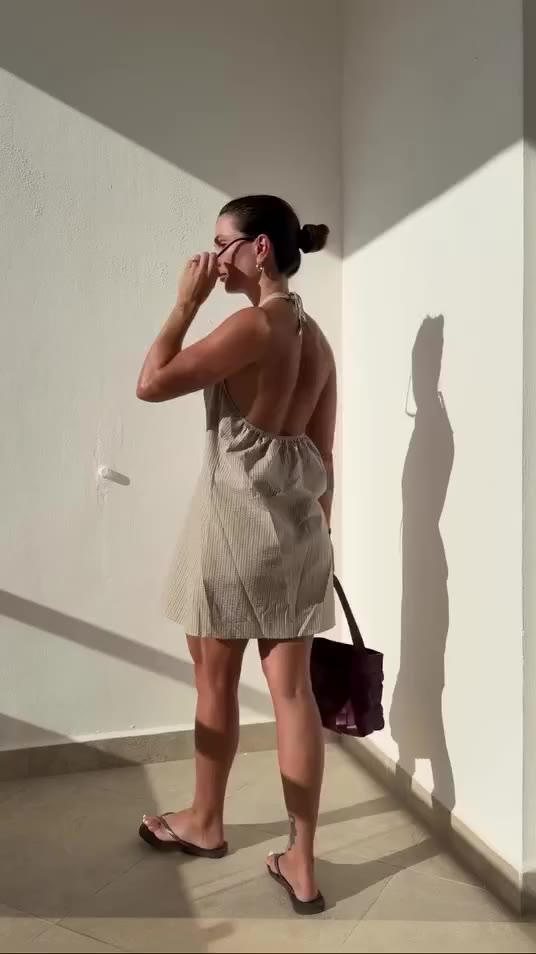 Joni, in her element.⁠ ⁠ The Joni Mini Dress in Taupe Stripe - a soft…