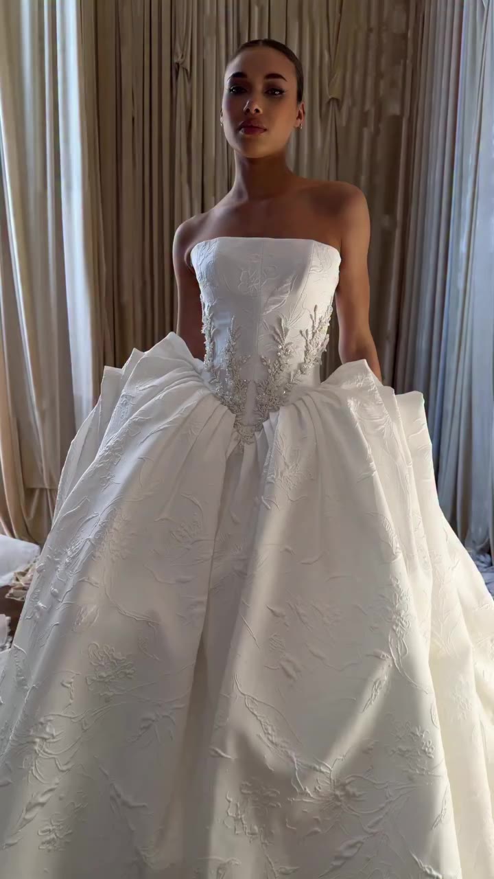 Here she is. The wedding gown, the sculpture silhouette, the corseted bodice …