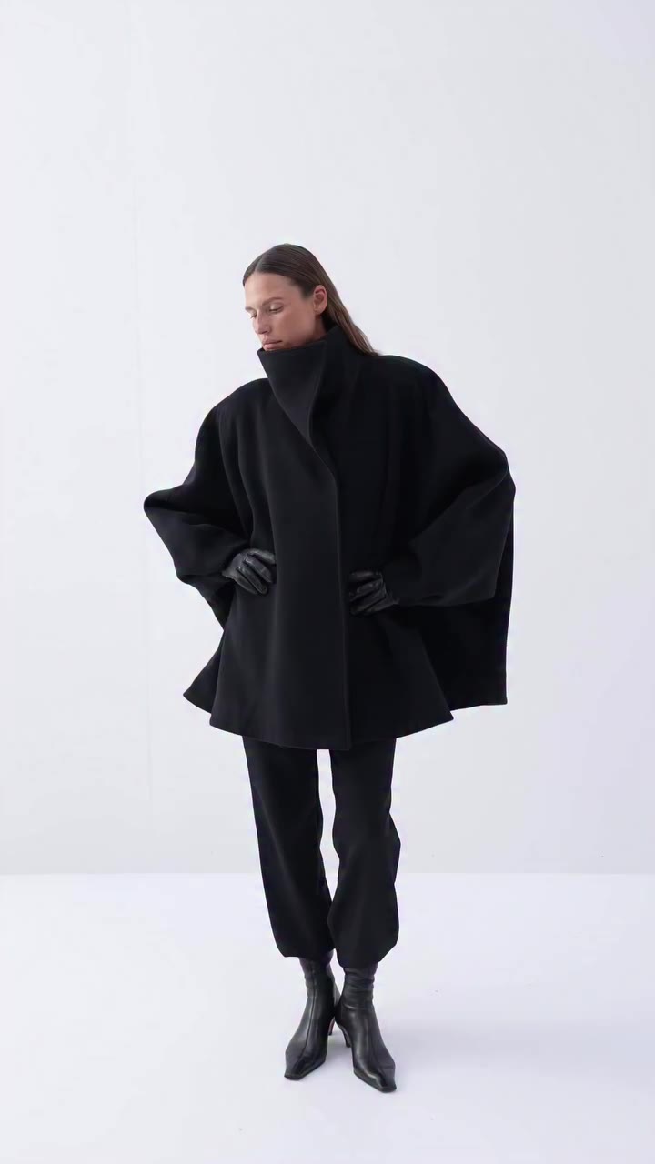 The Signature Short Coat. A sculptural silhouette crafted from wool and…