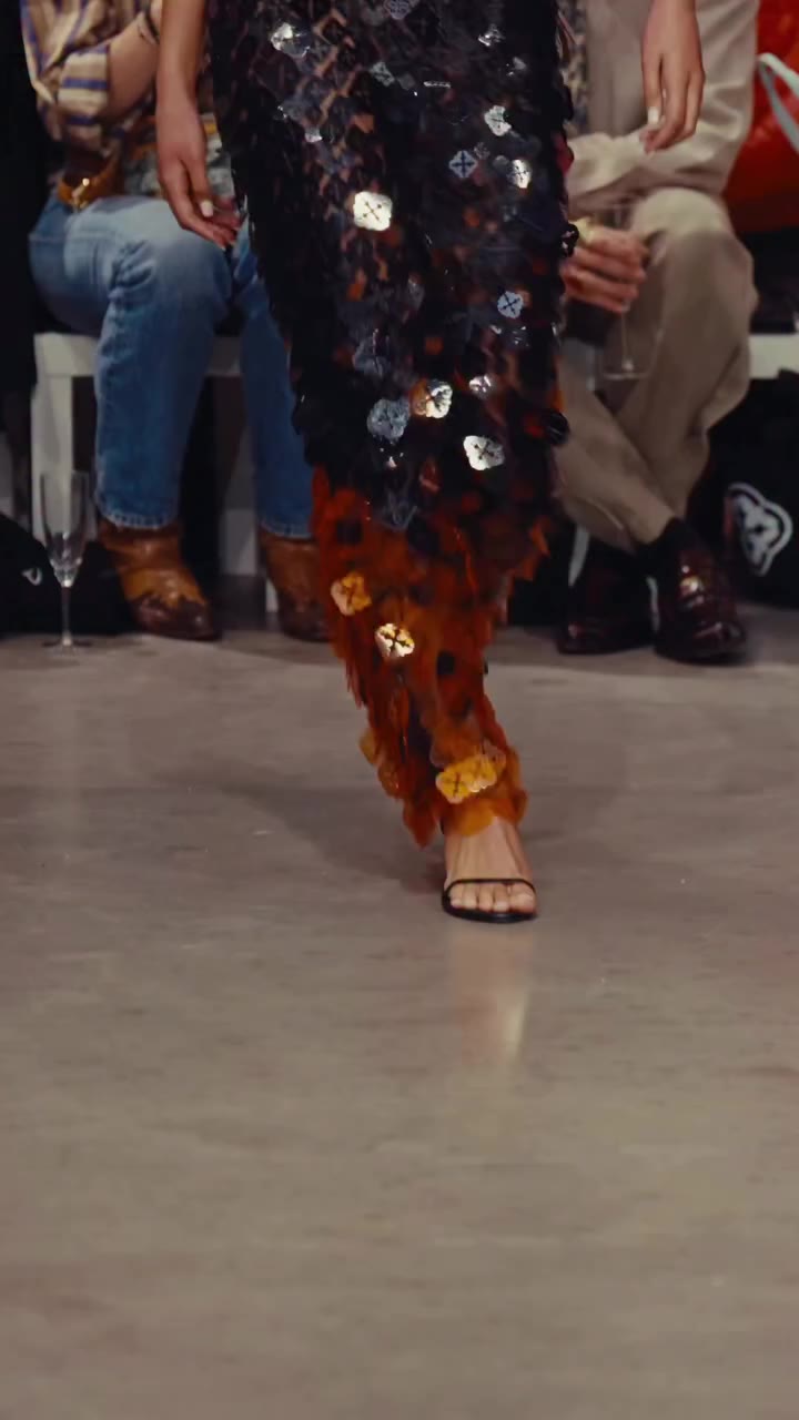 RE:BIRTH SS27 LOOK 5 – EMBLEM LOGO DRESS The Emblem Logo Dress is a halter…