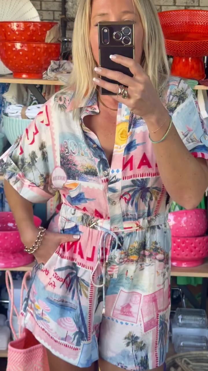 Throw this on and suddenly you’ve got plans. 😉 Our Postcards Playsuit is…