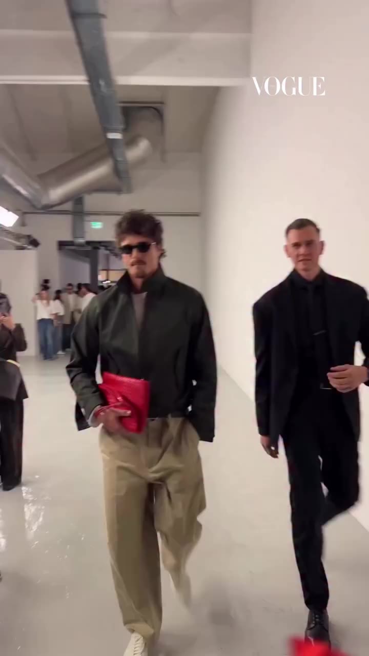 The man bag is alive and thriving. Jacob Elordi carries a red Bottega bag…