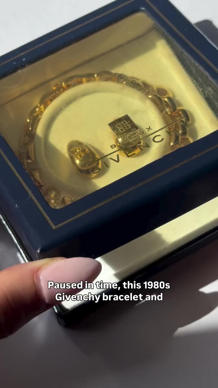 Givenchy 1980’s gold plated logo bracelet and pierced earring set in box…